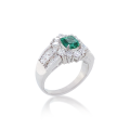 EMERALD GOLD RING 18K STUDDED WITH DIAMONDS . EMERALD GOLD RING 18K STUDDED WITH DIAMONDS .