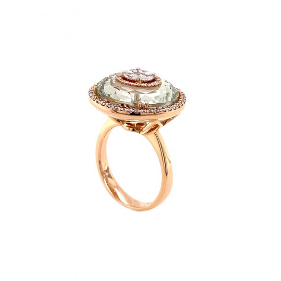 Gold ring studded with diamonds in a round shape with a green Amethyst stone Gold ring studded with diamonds in a round shape with a green Amethyst stone