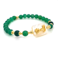BRACELET IN THE NAME OF AL-JALALAH ALAZEEZ, CRAFTED ON A WHITE SEASHELL WITH GREEN JADEAND MALACHITE BRACELET IN THE NAME OF AL-JALALAH ALAZEEZ, CRAFTED ON A WHITE SEASHELL WITH GREEN JADEAND MALACHITE