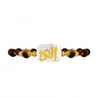 A bracelet in the name of Al-Jalalah Al-Noor, crafted on white seashells, with tiger eyes, brown quartz and seashells