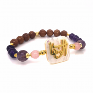 bracelet in the name of Al-Jalalah Al-Wahhab, crafted on a white seashell with amasetrin, pink quartz, Amathyst, and coke wood