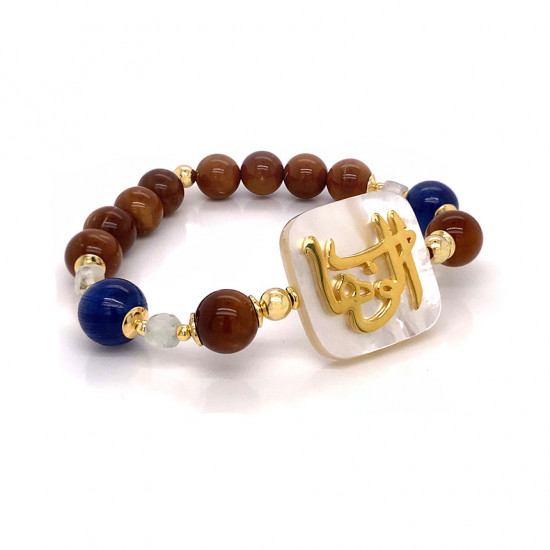 BRACELET IN THE NAME OF AL-JALALAH AL-ALWAHHAB, CRAFTED ON A WHITE SEASHELL WITH cook, fluorite and kyanite BRACELET IN THE NAME OF AL-JALALAH AL-ALWAHHAB, CRAFTED ON A WHITE SEASHELL WITH cook, fluorite and kyanite