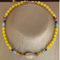 A pink quartz stone necklace crafted with the name of His Majesty (Allah) on it, with aquamarine , cherry quartz, pink quartz ، garnit ,yellow agate A pink quartz stone necklace crafted with the name of His Majesty (Allah) on it, with aquamarine , cherry quartz, pink quartz ، garnit ,yellow agate