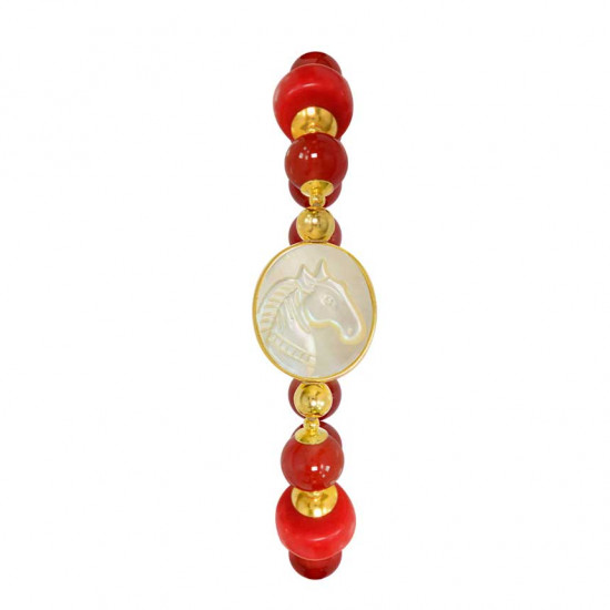 A horse seashell with a red coral stone, and a red agate stone