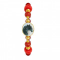 A horse seashell with a red coral stone, and a red agate stone