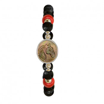 A horse seashell with a volcanic stone, a red coral stone, and a red agate stone