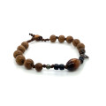 STRING BRACELET WITH GOLDEN CORAL, COCONUT WOOD, AND AGARWOOD