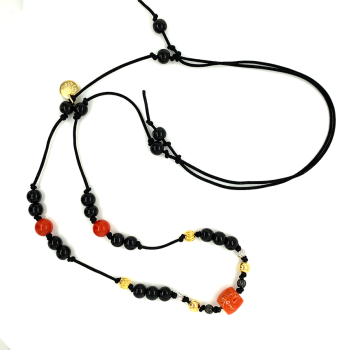 Coral necklace with black coke wood .