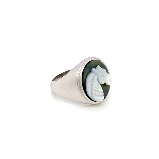 White silver sea-shell horse ring on black seashell crated in deferent colors White silver sea-shell horse ring on black seashell crated in deferent colors