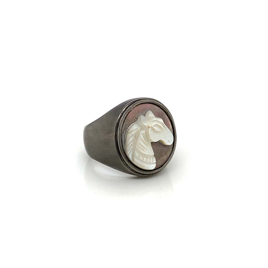 White silver sea-shell horse ring on black seashell crated in deferent colors White silver sea-shell horse ring on black seashell crated in deferent colors