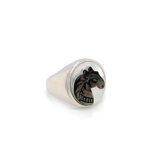 Black silver sea-shell horse ring on white seashell crated in deferent colors Black silver sea-shell horse ring on white seashell crated in deferent colors
