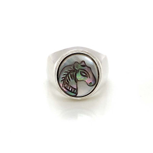 A wide silver ring with a small two-tone horse seashell