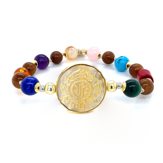 Silver Bracelet made of Saudi prominent black pound shell with shakirat stones ( Malachite , red coral , turquoise , pink quartz , citrine , amythest , amber , lapis and cook wood ) Silver Bracelet made of Saudi prominent black pound shell with shakirat stones ( Malachite , red coral , turquoise , pink quartz , citrine , amythest , amber , lapis and cook wood )