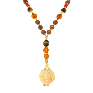 A NECKLACE MADE OF SAUDI GOLD POUND SHELL WITH TIGER-EYE , JASPER ,  AMBER , CORAL AND COKE WOOD 