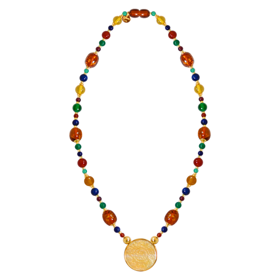 A NECKLACE MADE OF SAUDI GOLD POUND SHELL WITH red AGATE , YELLOW AGATE , lapis, amber, green AGATE and garnet with amber musk A NECKLACE MADE OF SAUDI GOLD POUND SHELL WITH red AGATE , YELLOW AGATE , lapis, amber, green AGATE and garnet with amber musk