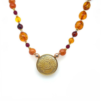 A NECKLACE MADE OF SAUDI POUND SHELL WITH SULEIMANI AGATE, RUBY AGATE AND AMBER