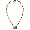 A NECKLACE MADE OF SAUDI GOLD POUND SHELL WITH pink quartz, garnet, amber, amastrin, malachite and lapis A NECKLACE MADE OF SAUDI GOLD POUND SHELL WITH pink quartz, garnet, amber, amastrin, malachite and lapis