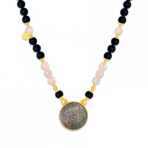 A NECKLACE MADE OF SAUDI POUND SHELL WITH ONYX AND PINKQUARTZ