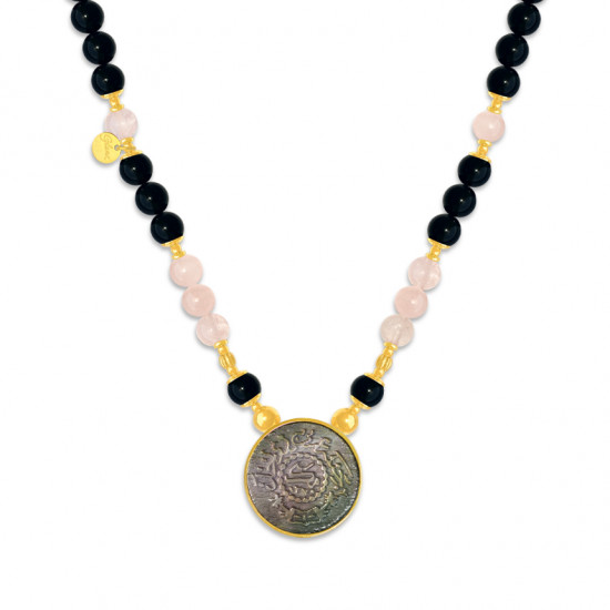 A NECKLACE MADE OF SAUDI POUND SHELL WITH ONYX AND PINKQUARTZ