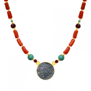A NECKLACE MADE OF SAUDI POUND SHELL WITH CORAL, RUBY AND TURQUOISE