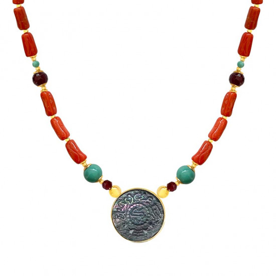 A NECKLACE MADE OF SAUDI POUND SHELL WITH CORAL, RUBY AND TURQUOISE
