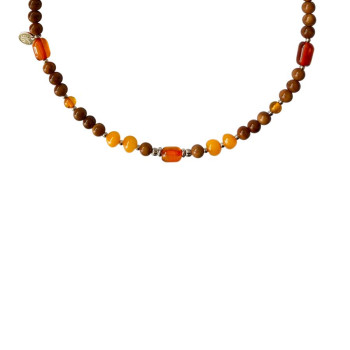 KIDS NECKLACE WITH AMBER STONES , AND COKE WOOD .