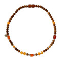 KIDS NECKLACE WITH AMBER STONES , AND COKE WOOD .