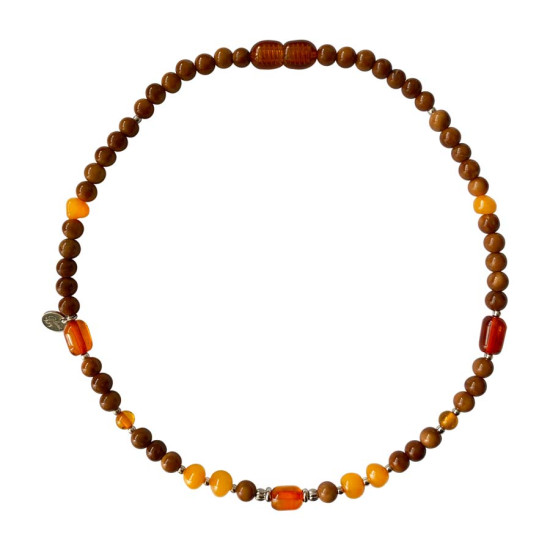 KIDS NECKLACE WITH AMBER STONES , AND COKE WOOD .