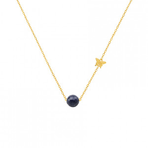 gold necklace with sapphire stone .