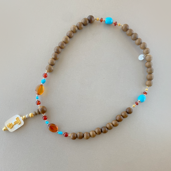 BEARISH IN THE NAME OF AL-JALALAH -ALAZIZ CRAFTED ON A WHITE SEASHELL WITH AMBER , Turquoise , RED AGATE . OUD WOOD