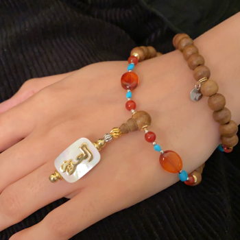 BEARISH IN THE NAME OF AL-JALALAH -ALAZIZ CRAFTED ON A WHITE SEASHELL WITH AMBER , Turquoise , RED AGATE . OUD WOOD