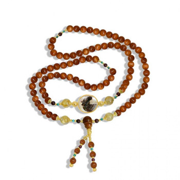 Rosary in prominent white horse seashell with coke wood, gold strings and garnet