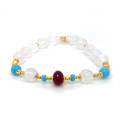 GOLD PLATED 18K RUBY BRACELET WITH TURQUOISE AND MOON STONE .