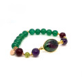 RUBY, ZOISITE, AND AMETHYST BRACELET WITH GREEN BERYL, RUBY, AND GREEN