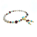 HOWLITE IMAM BRACELET WITH GARNET, RUBY AGATE, AND LABRADORITE