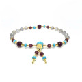 HOWLITE IMAM BRACELET WITH GARNET, RUBY AGATE, AND LABRADORITE