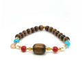 BRACELET WITH YESR STONE (GOLDEN CORAL), RED CORAL, PEARL AND AMAZONITE STONES